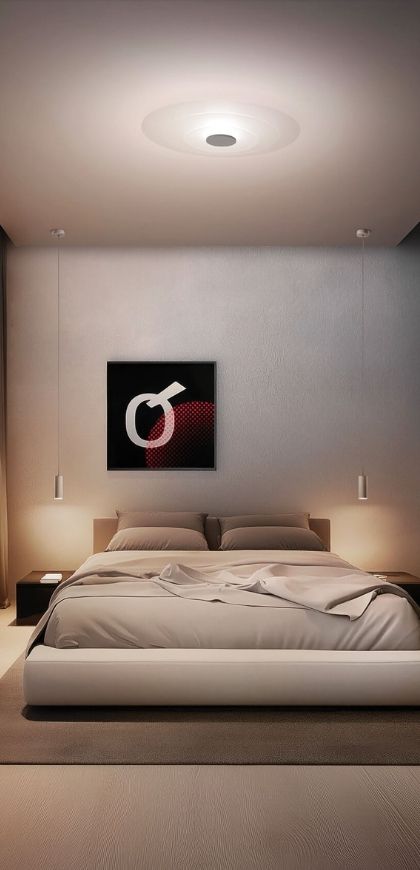 Ruhiges Schlafzimmer mit der flachen, runden Deckenleuchte Joint von Linea Light über dem Bett